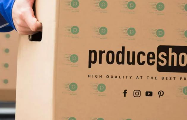 Trinity Gate Investments interview with ProduceShop, delivery man holding a Produceshop box