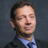 Portrait of John Tobin-de la Puente, Professor of Practice at Cornell University